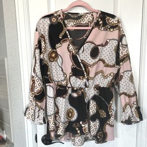 Long peplum style top with poet sleeves